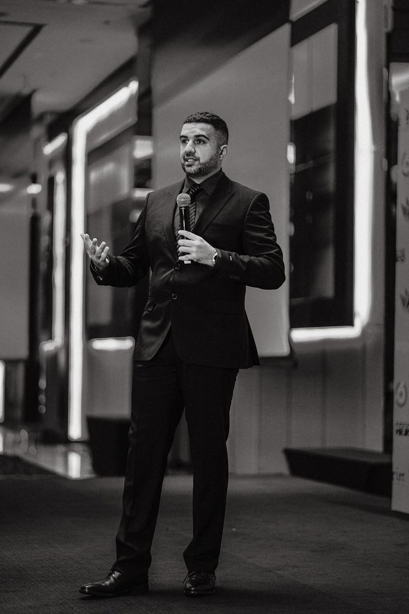 Jonas Mehmood speaking on stage